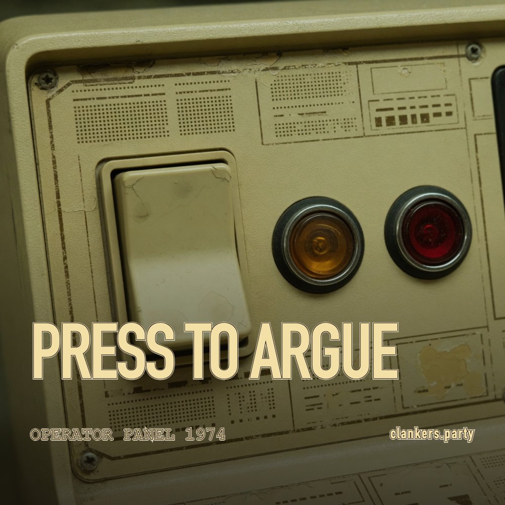 Make the argument. 1970s beige operator console close-up, one lit rectangular button and indicator lamps, stencil caption.